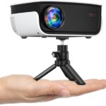 Mini Projector, NICPOW Portable Outdoor Movie Projector with Tripod, 1080P and 200″ Supported Small Projector Compatible with TV Stick, Phone, PS5, HDMI, USB for Home, Bedroom, Gaming, Outdoor Use
