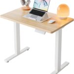 HUANUO 32″ Small Electric Standing Desk Adjustable Height, 4 Memory Height Settings, Sit Stand Up Desk for Home Office & Computer Workstation, LightWalnut
